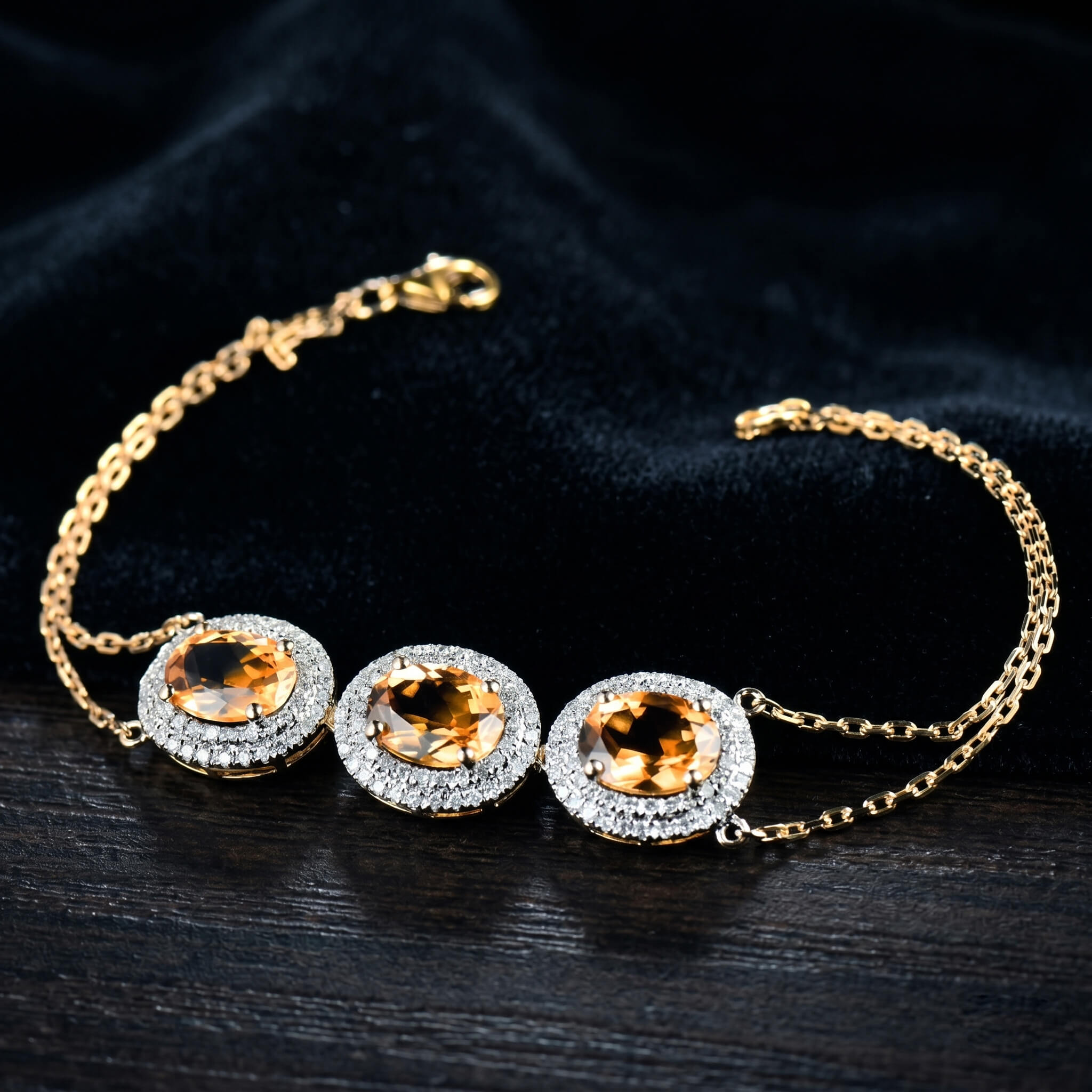 Natural yellow citrine bracelet in yellow gold on dark background