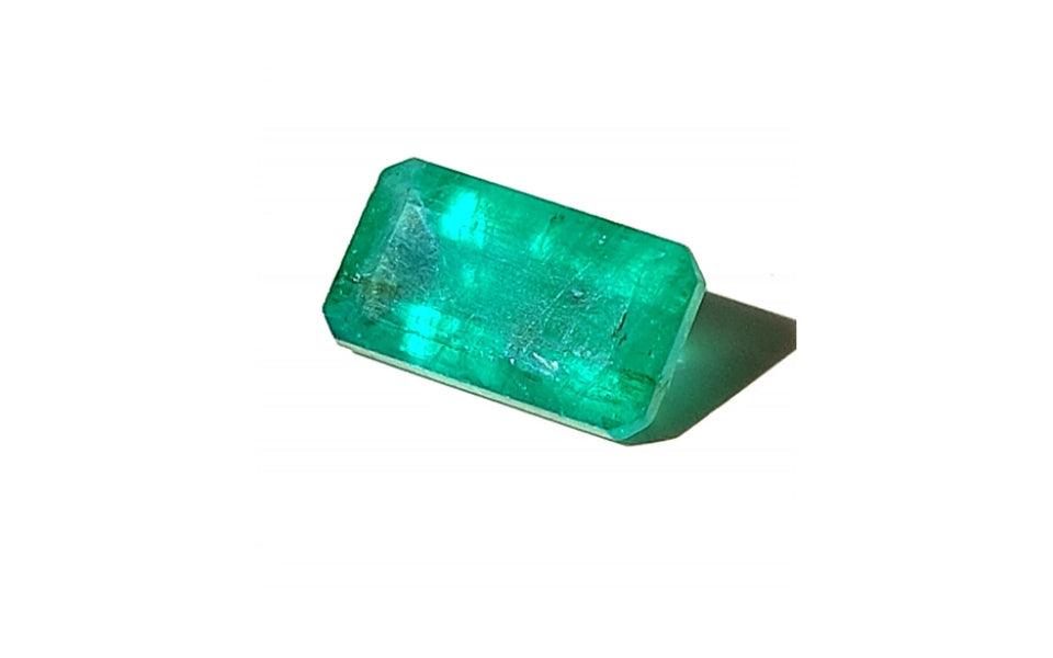 1.51 ct green emerald in octagonal step cut with visible inclusions