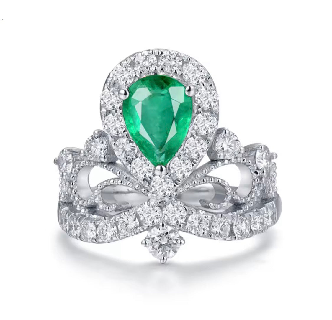 18K white gold emerald diamond ring with pear cut emerald and crown princess halo design