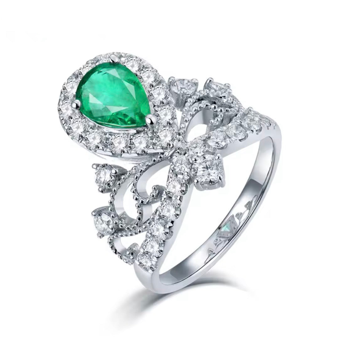 18K white gold emerald diamond ring with pear cut emerald and crown princess halo design