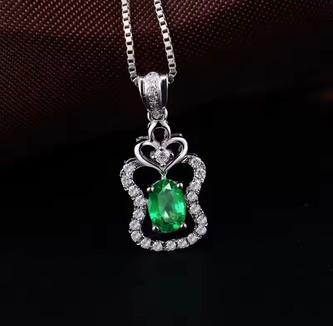 18K white gold emerald diamond pendant with 0.45 carat oval natural emerald and heart halo design
