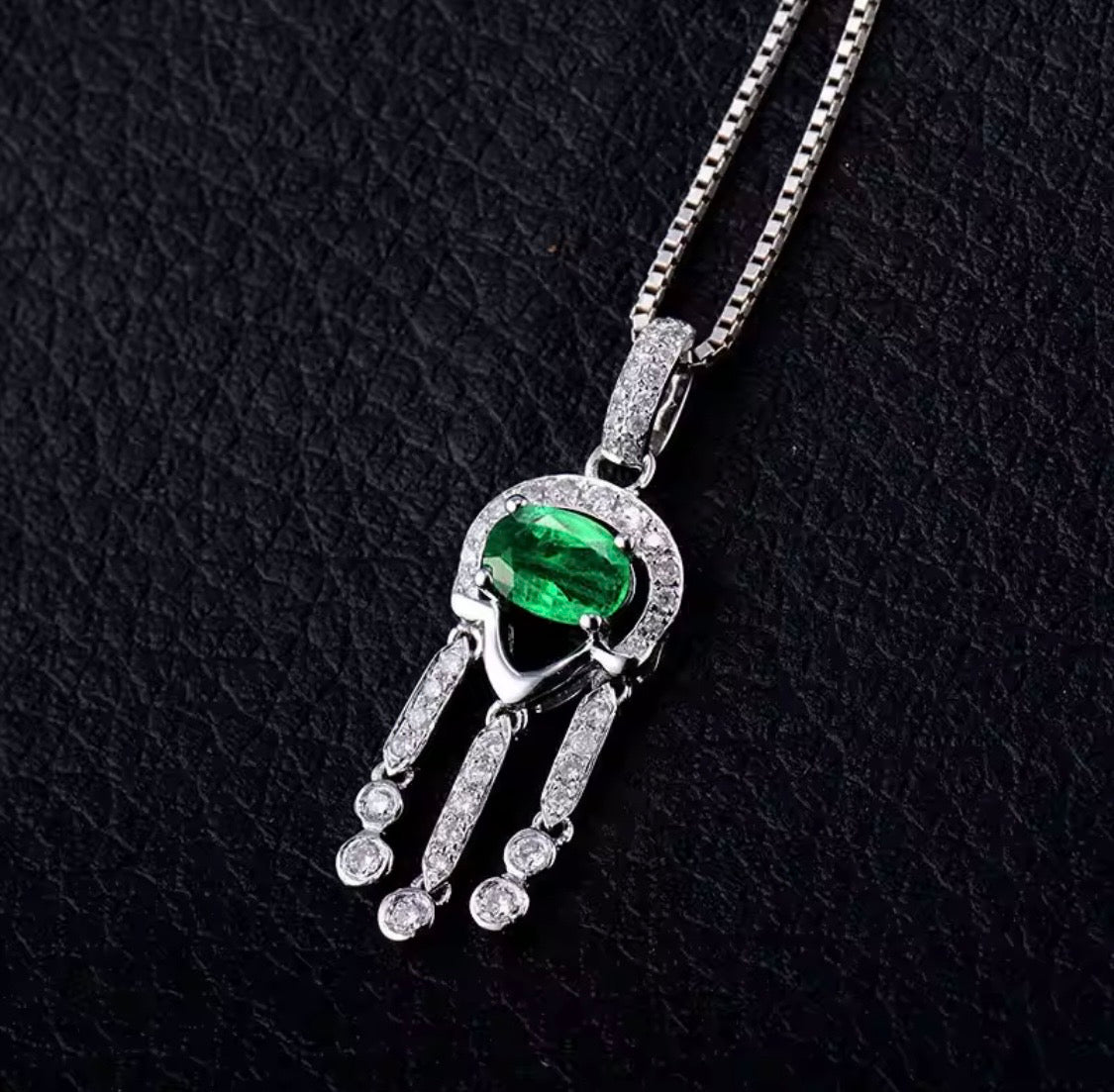 18K white gold emerald diamond pendant with oval natural emerald and geometric drop design