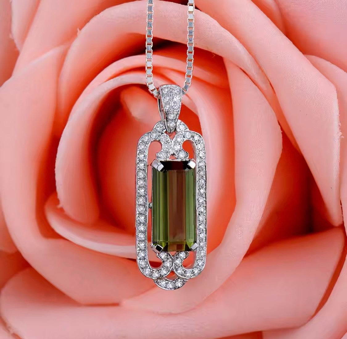 14K gold green tourmaline pendant with 2.05 carat emerald cut gemstone and diamond frame