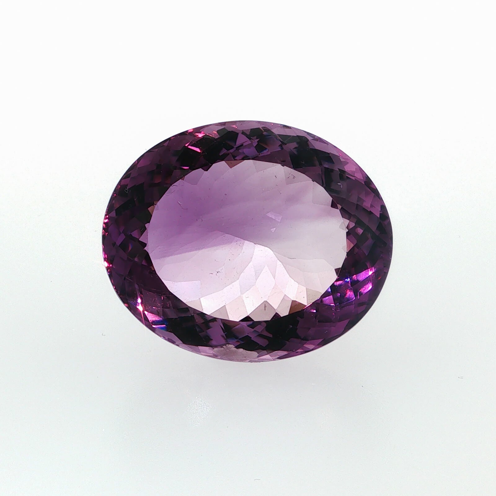 Natural amethyst, 106.80 carats, oval cut, clarity: eye clean, purple color, measuring 35.65 × 29.53 × 17.48 mm