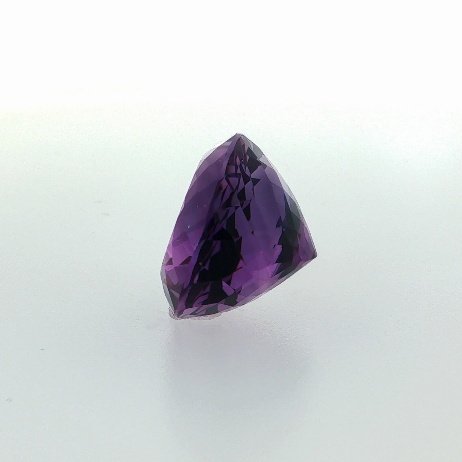 Natural amethyst, 33.56 carats, oval cut, clarity: eye clean, rich purple color, measuring 23.80 × 18.60 × 13.70 mm