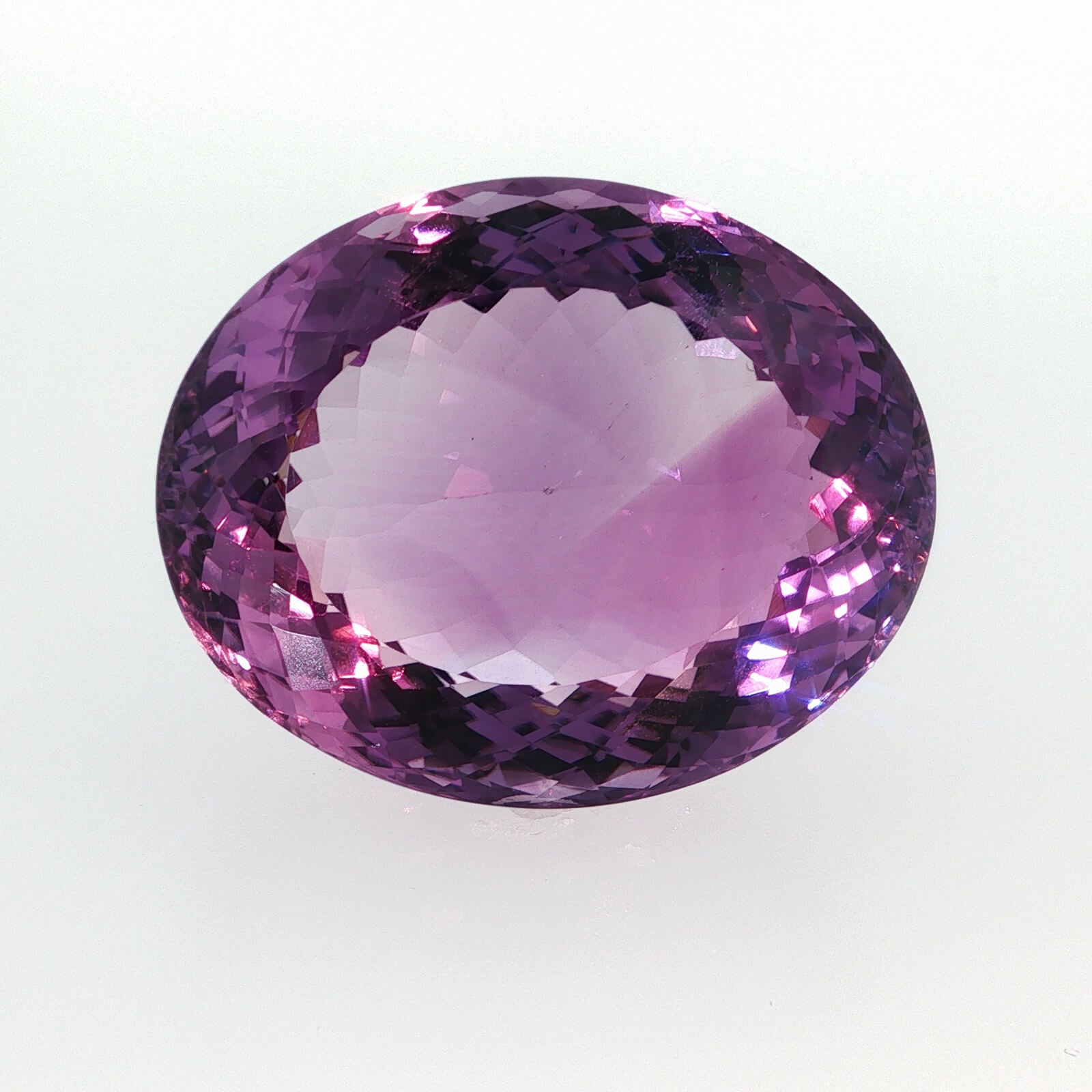 Natural amethyst, 97.50 carats, oval cut, clarity: eye clean, purple color, measuring 33.99 × 27.62 × 16.91 mm