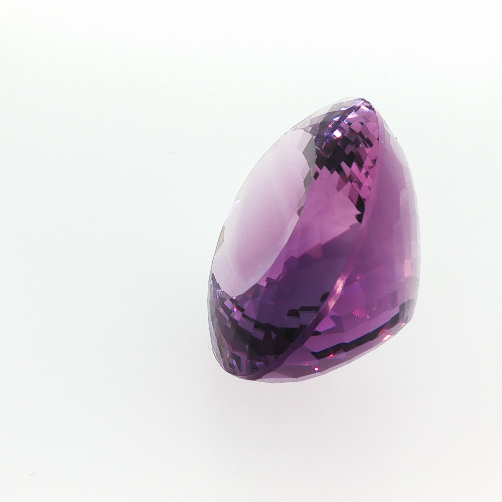 Natural amethyst, 97.50 carats, oval cut, clarity: eye clean, purple color, measuring 33.99 × 27.62 × 16.91 mm