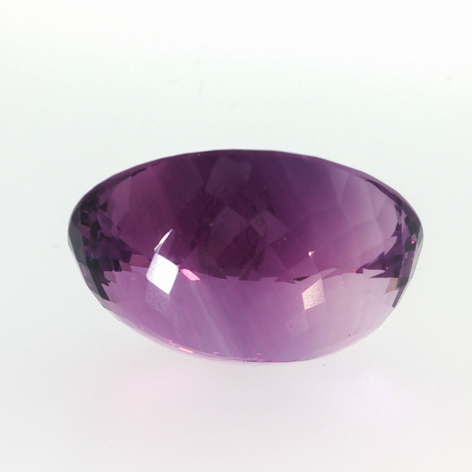Natural amethyst, 97.50 carats, oval cut, clarity: eye clean, purple color, measuring 33.99 × 27.62 × 16.91 mm