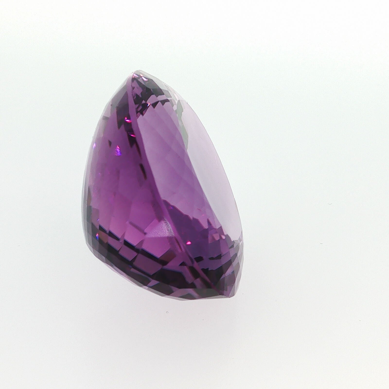 Natural amethyst, 97.50 carats, oval cut, clarity: eye clean, purple color, measuring 33.99 × 27.62 × 16.91 mm