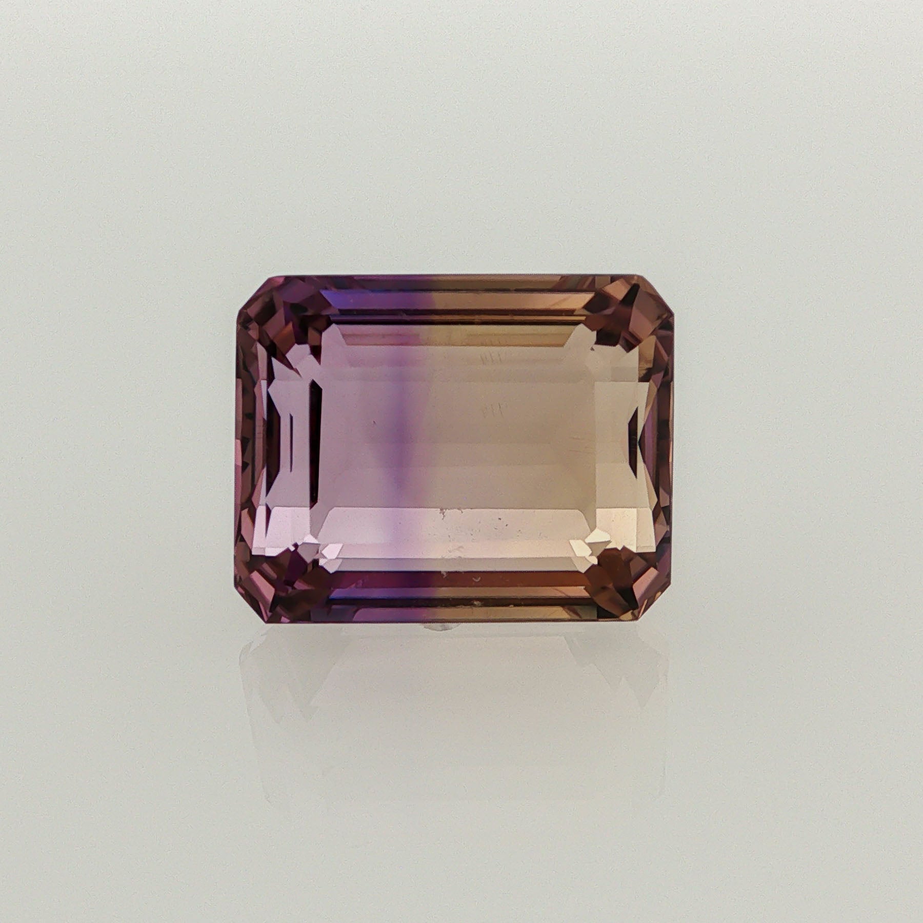 Natural ametrine, bicolor - vivid purple / vivid yellow, emerald cut, 14.37 ct, loose gemstone.