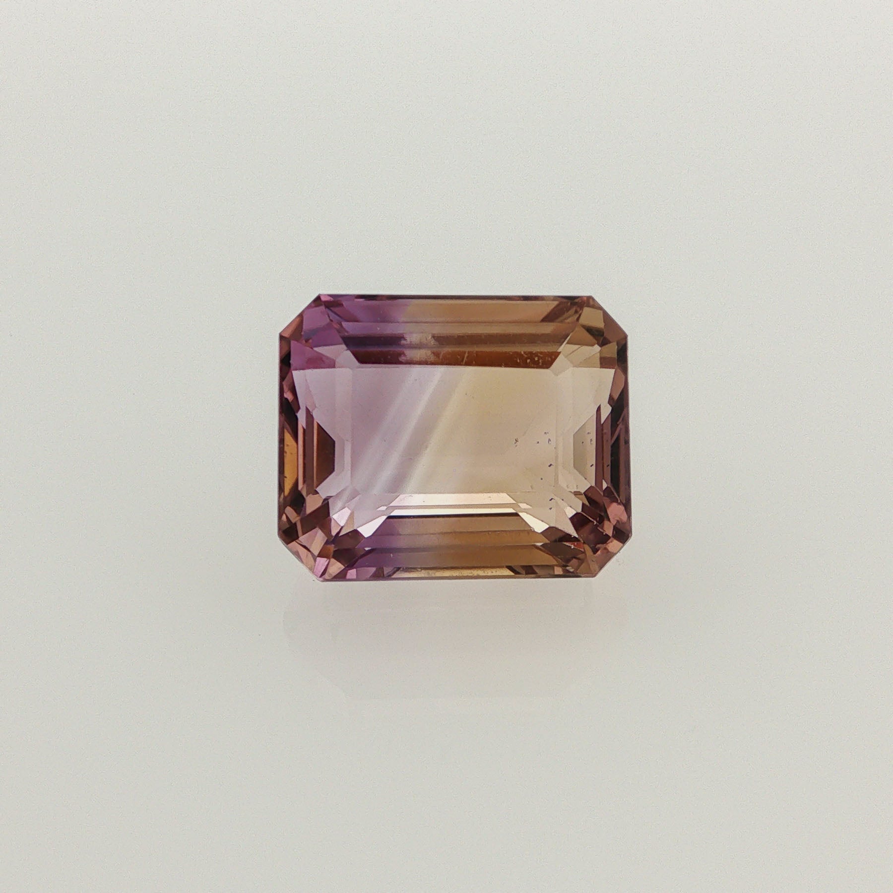 Natural ametrine, bicolor - purple / yellow, emerald cut, 15.23 ct, loose gemstone.