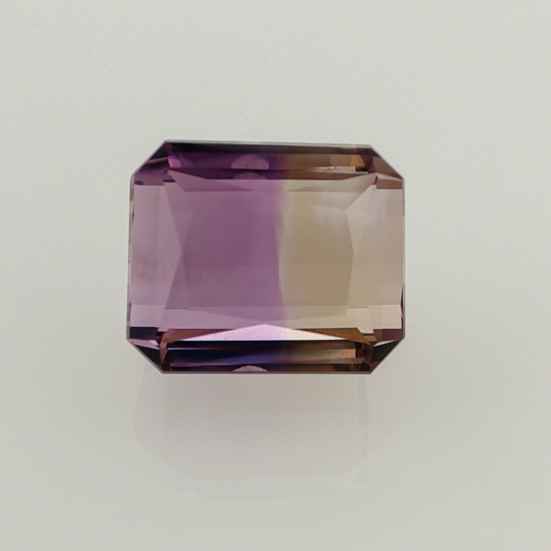 Natural ametrine, bicolor - vivid purple / vivid yellow, octagon cut, 16.11 ct, loose gemstone.
