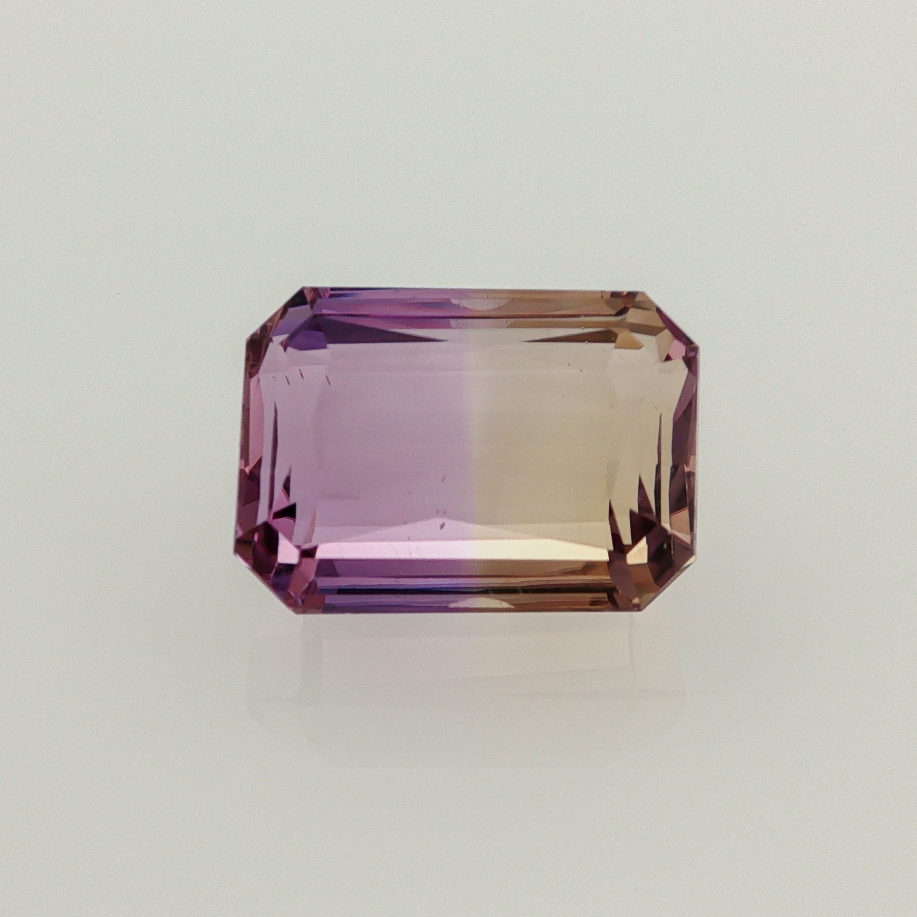 Natural ametrine, bicolor - vivid purple / vivid yellow, emerald cut, 16.66 ct, loose gemstone.