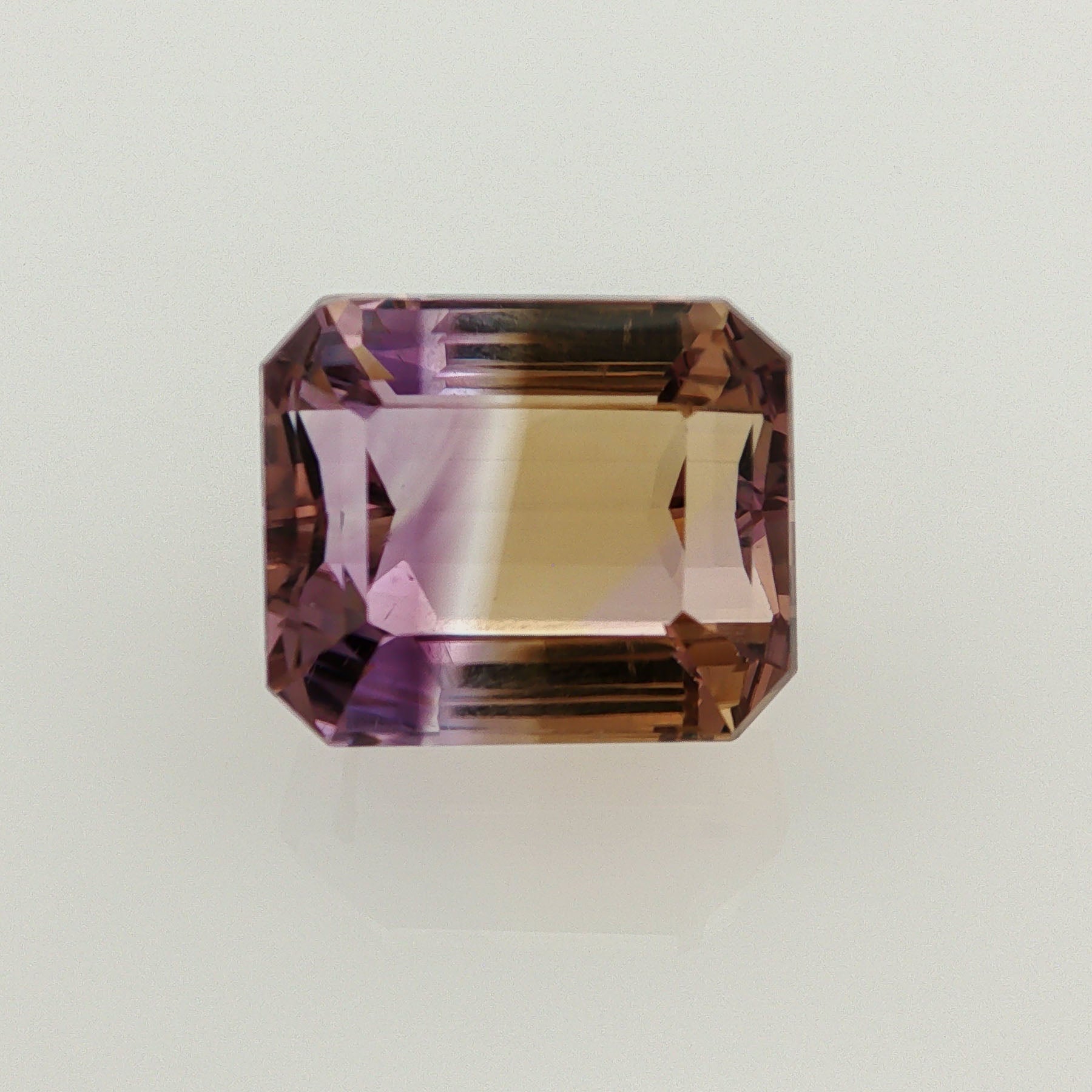 Natural ametrine, bicolor - vivid purple / vivid yellow, emerald cut, 19.57 ct, loose gemstone.