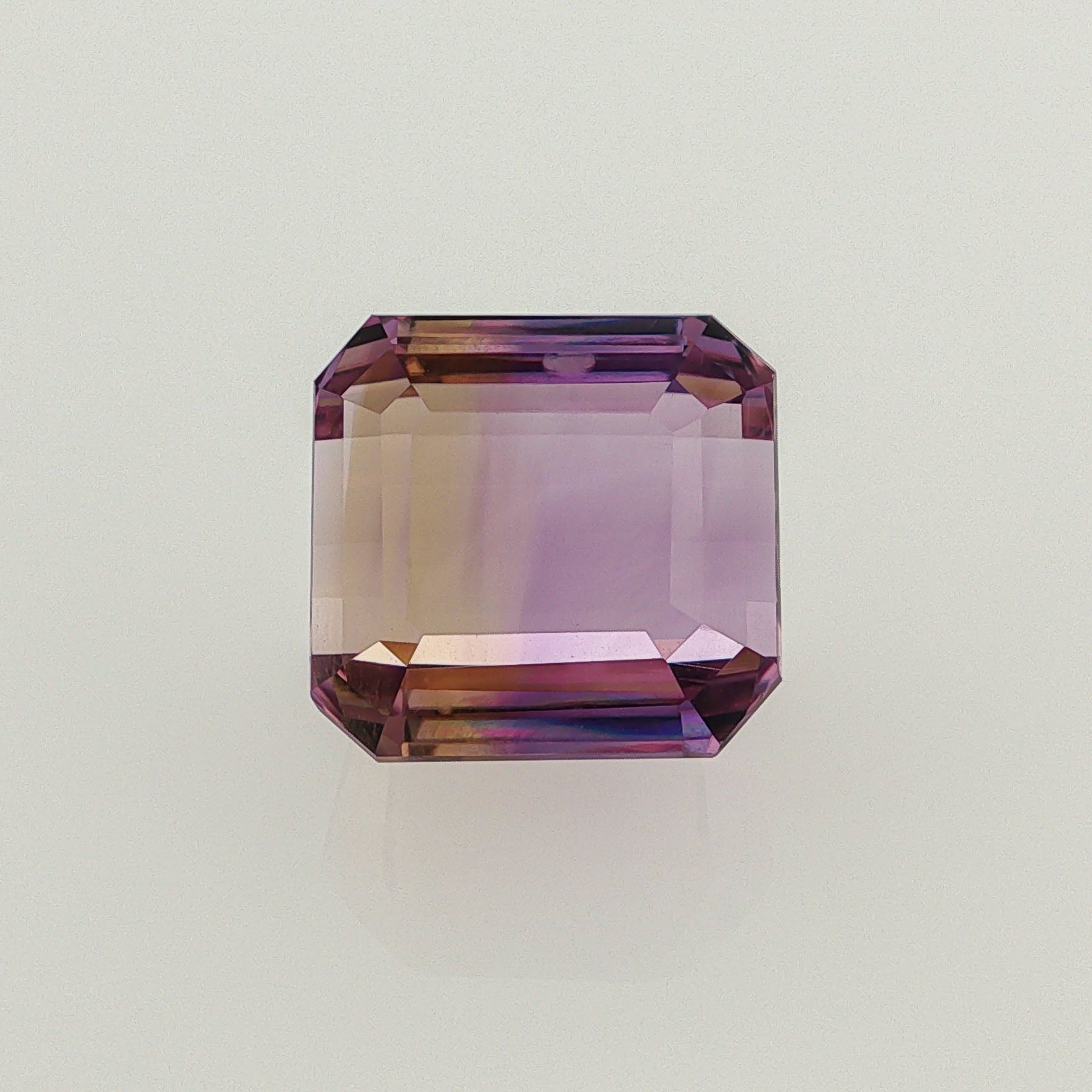 Natural ametrine, bicolor - purple / yellow, octagon cut, 21.86 ct, loose gemstone.