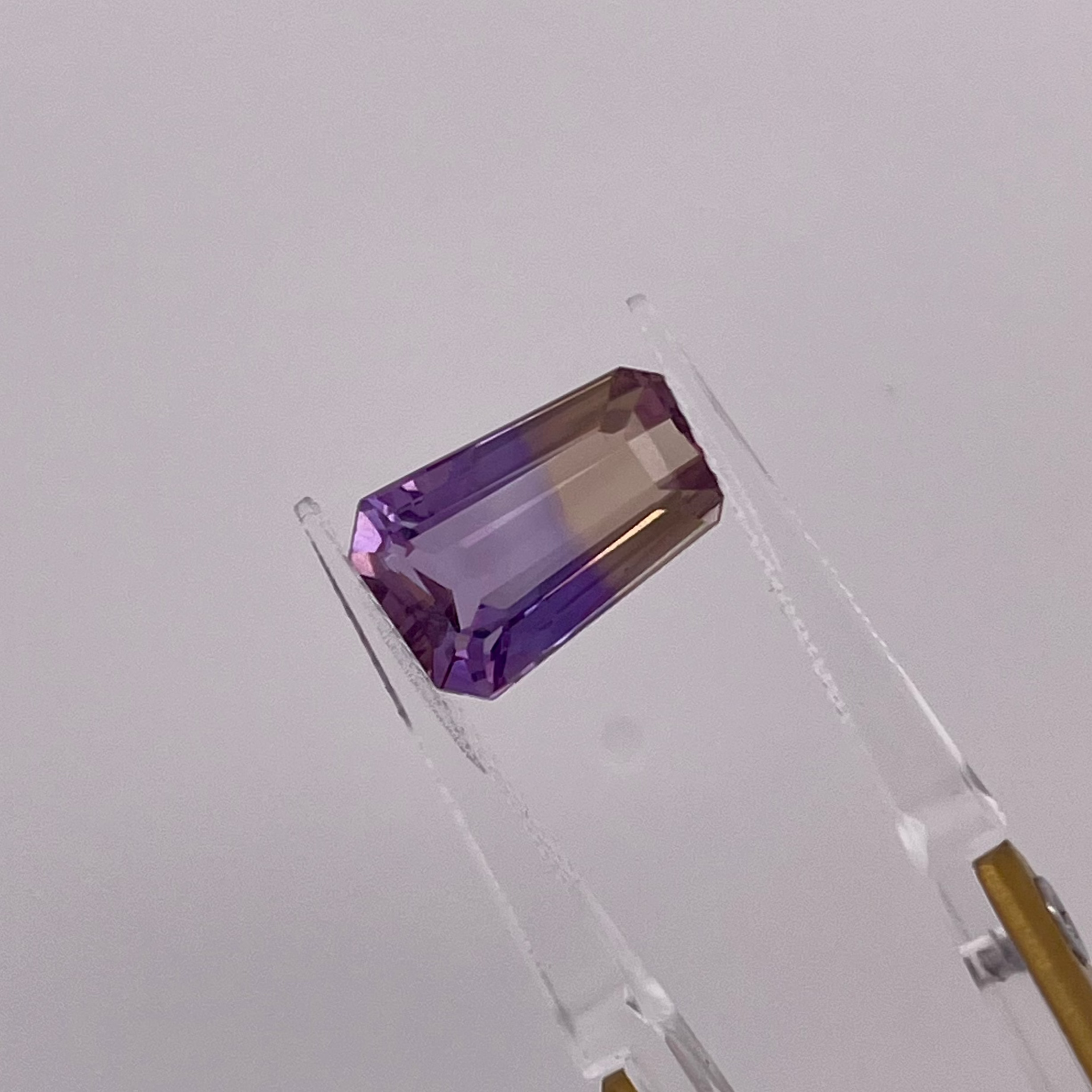 Natural Ametrine 5.92 carats, tapered baguette cut, purple and yellow bi-color gemstone, untreated