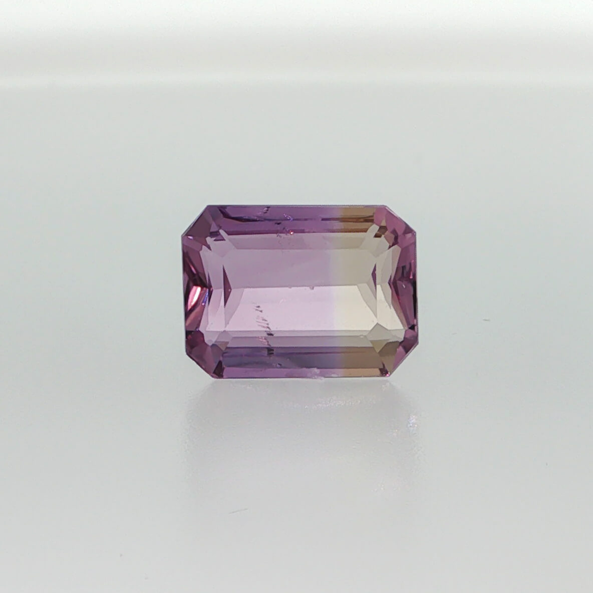 Natural untreated ametrine, 8.24 carats, emerald cut, clarity: slightly included, purple and golden yellow bi-color quartz, measuring 14.26 × 10.59 × 6.73 mm