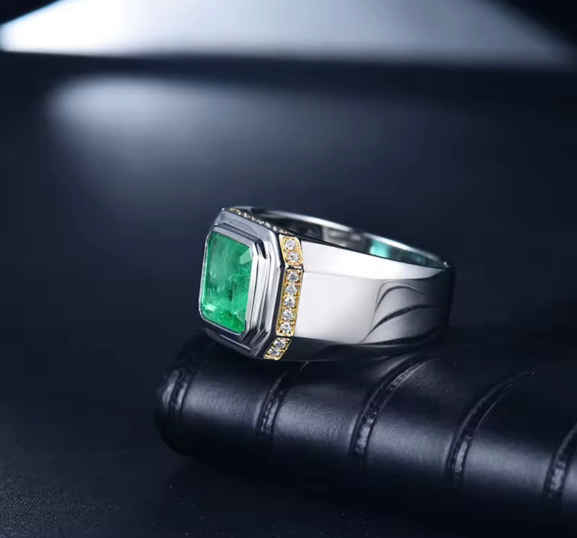 Natural emerald and diamond unisex statement ring in 18K white gold angle view