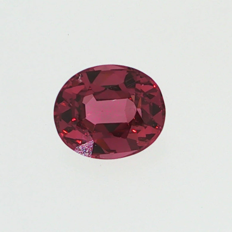 Natural pyrope-almandine garnet, 1.05 carats, oval cut, slightly orangy red color, transparent, ČGL certified gemstone