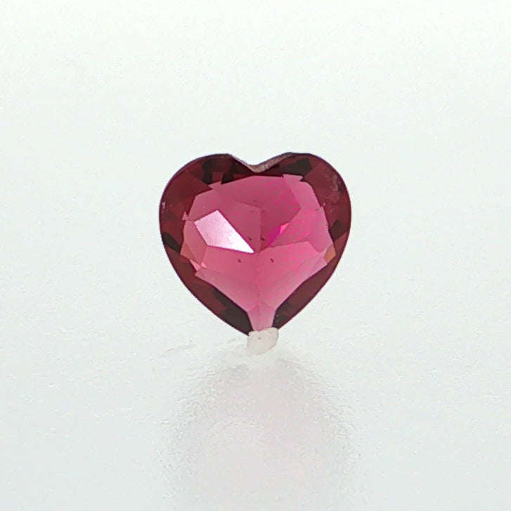 Natural rhodolite garnet, 1.36 carats, heart cut, slightly purplish red color, transparent, ČGL certified gemstone