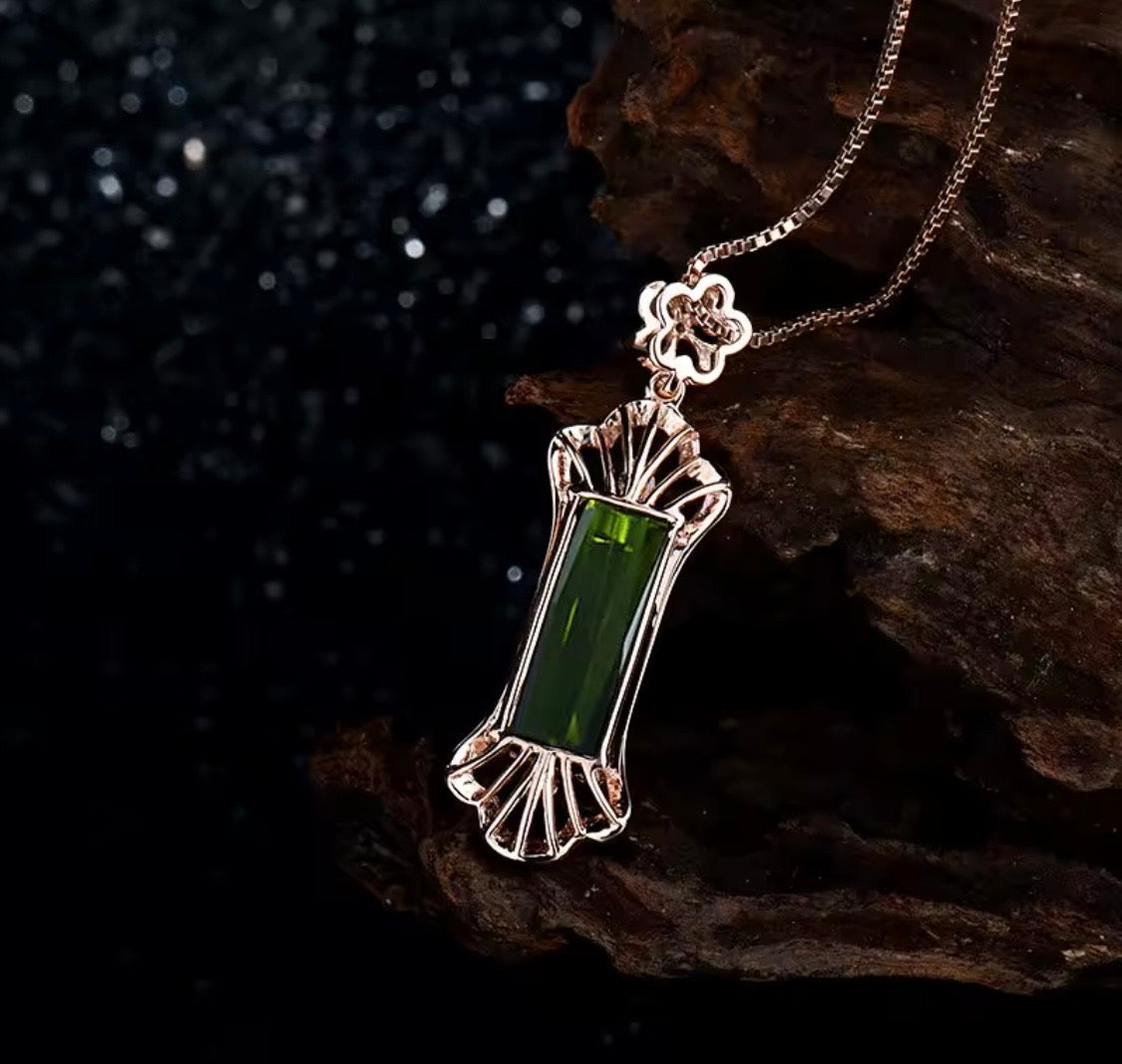 Natural green tourmaline and diamond pendant in 18K rose gold angle view