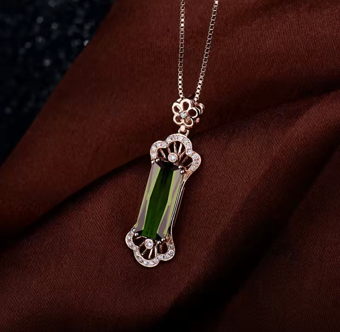 Natural green tourmaline and diamond statement pendant in 18K rose gold lifestyle view