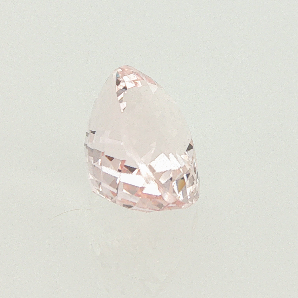Natural unheated morganite, light orangy pink, oval cut, 12.27 ct, loose gemstone.