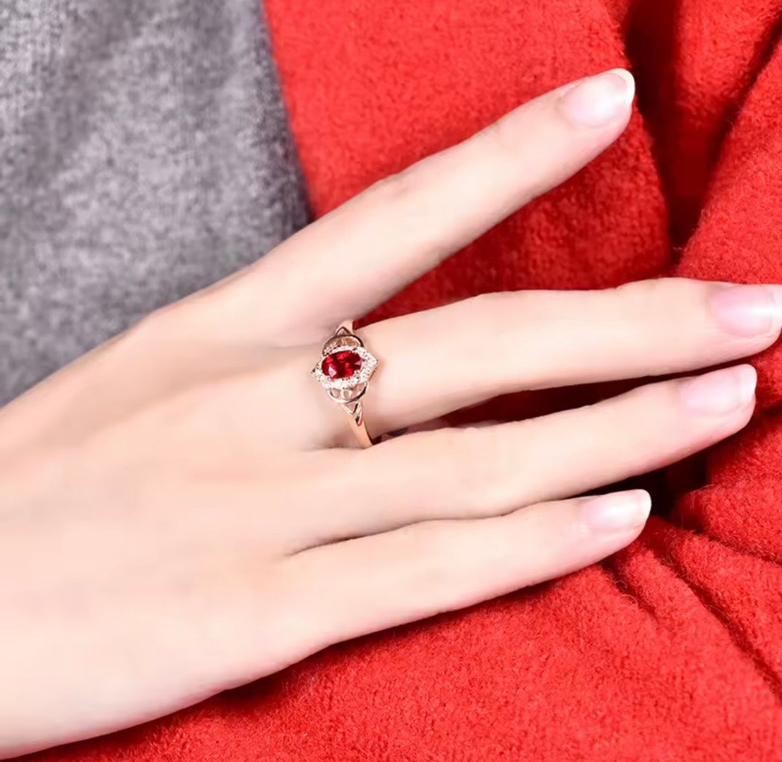 0.49 ct natural ruby and diamond ring in 14K rose gold worn on hand