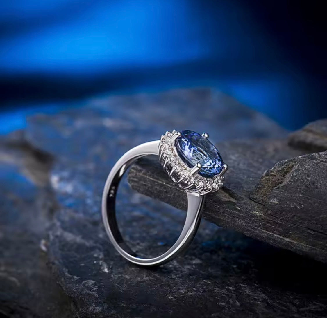 Natural tanzanite diamond halo ring in 18K white gold side view