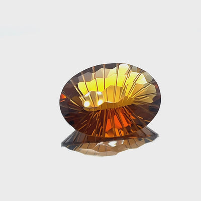 Natural honey citrine, 23.38 carats, oval honeycomb cut, IF clarity, untreated, honey orange color