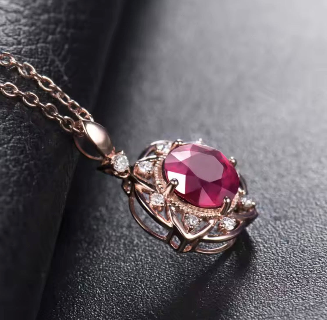 14K rose gold ruby diamond pendant with round natural ruby and floral halo design