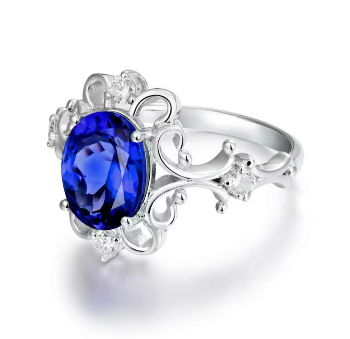 14K white gold tanzanite diamond ring with 1.70 carat oval natural tanzanite princess style design