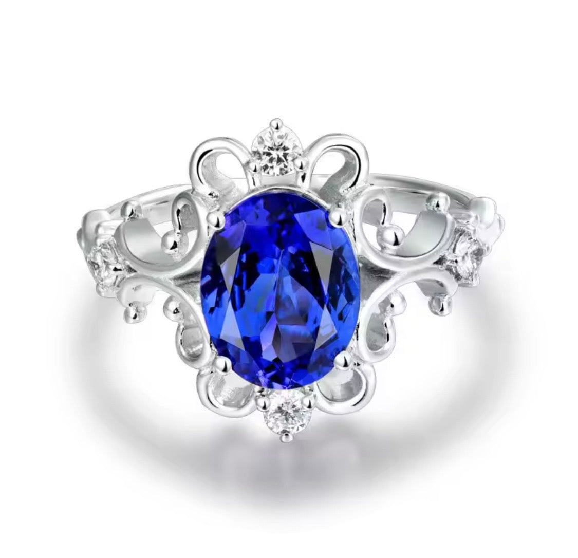 14K white gold tanzanite diamond ring with 1.70 carat oval natural tanzanite princess style design