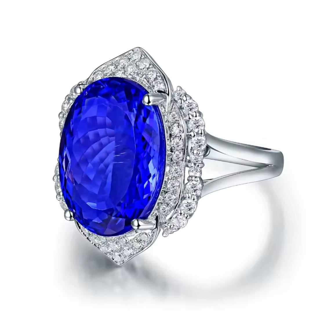 18K white gold tanzanite diamond ring with 8.45 carat oval natural tanzanite and diamond halo unisex