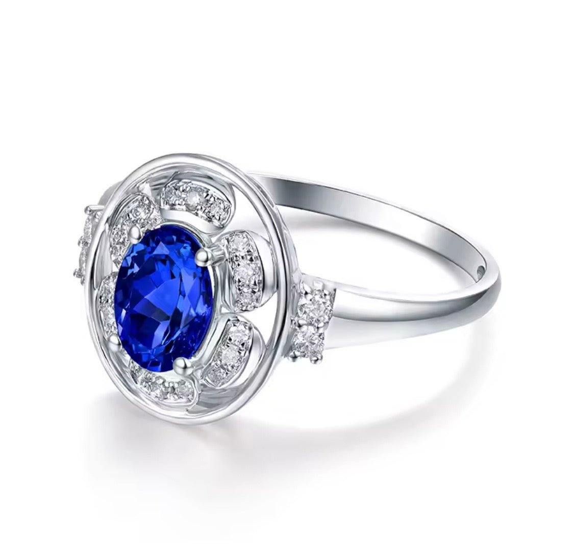 14K white gold tanzanite diamond ring with natural oval tanzanite and diamond halo design
