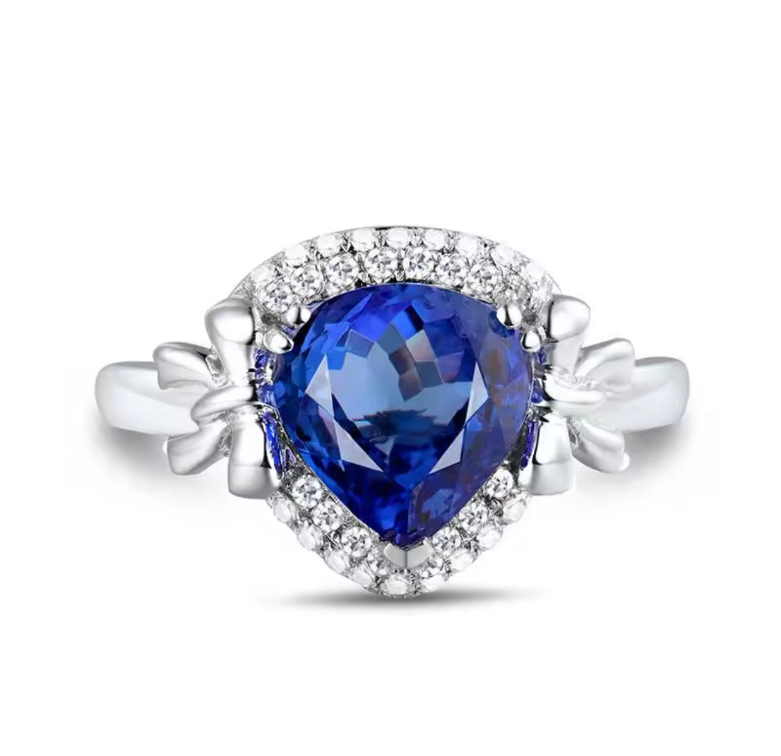 14K white gold tanzanite engagement ring with 2.01 carat pear cut natural tanzanite and diamond halo