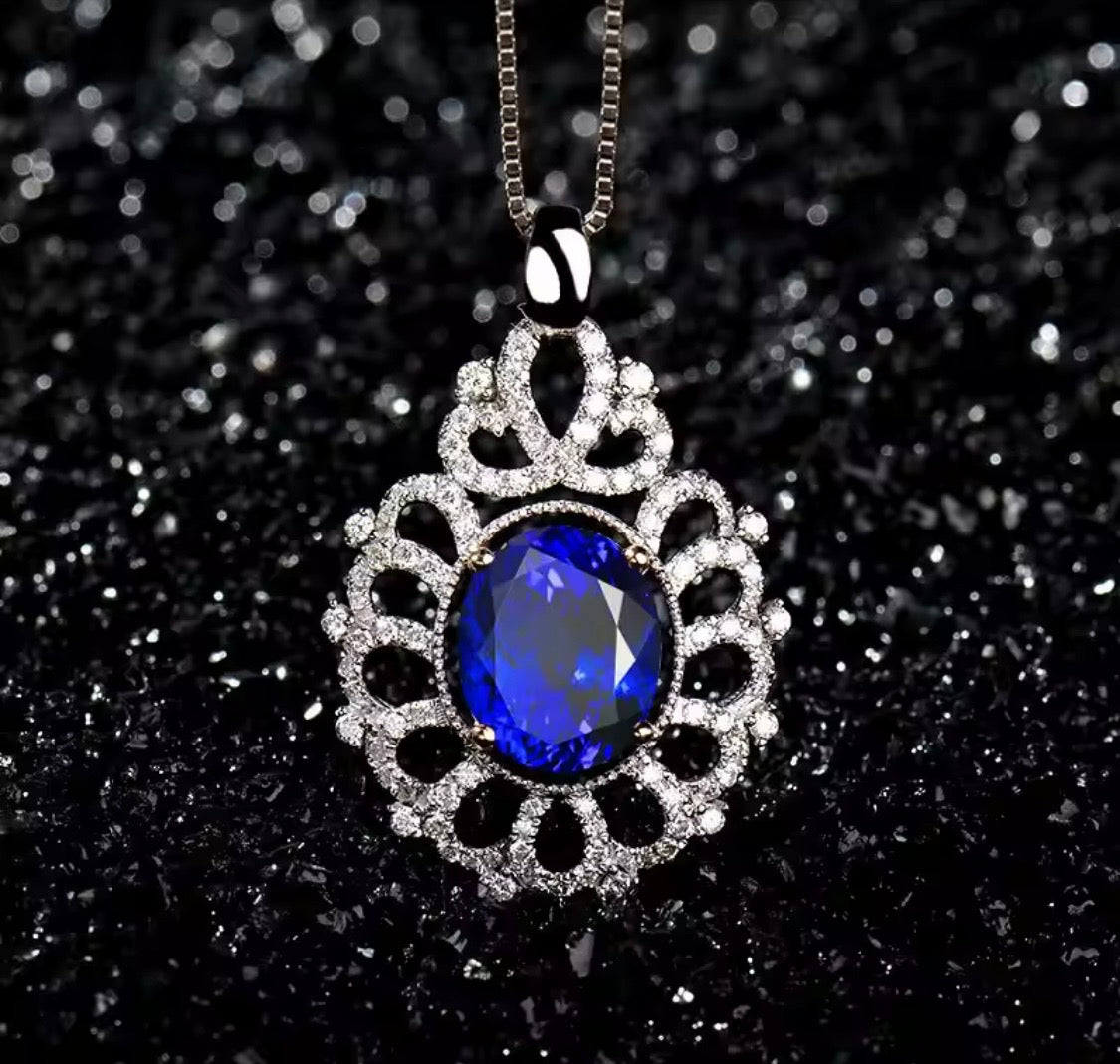 14K gold tanzanite pendant with 4.22 carat oval gemstone and diamond halo design