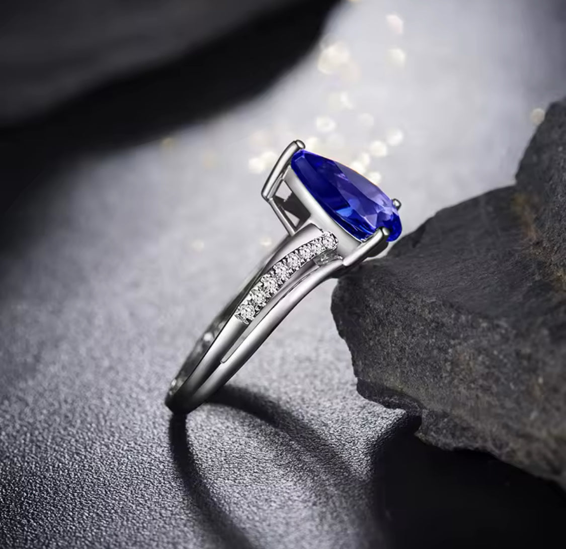 18K white gold tanzanite ring, 2.25 carat natural pear cut tanzanite, very good clarity, diamond accents, luxury fine jewelry