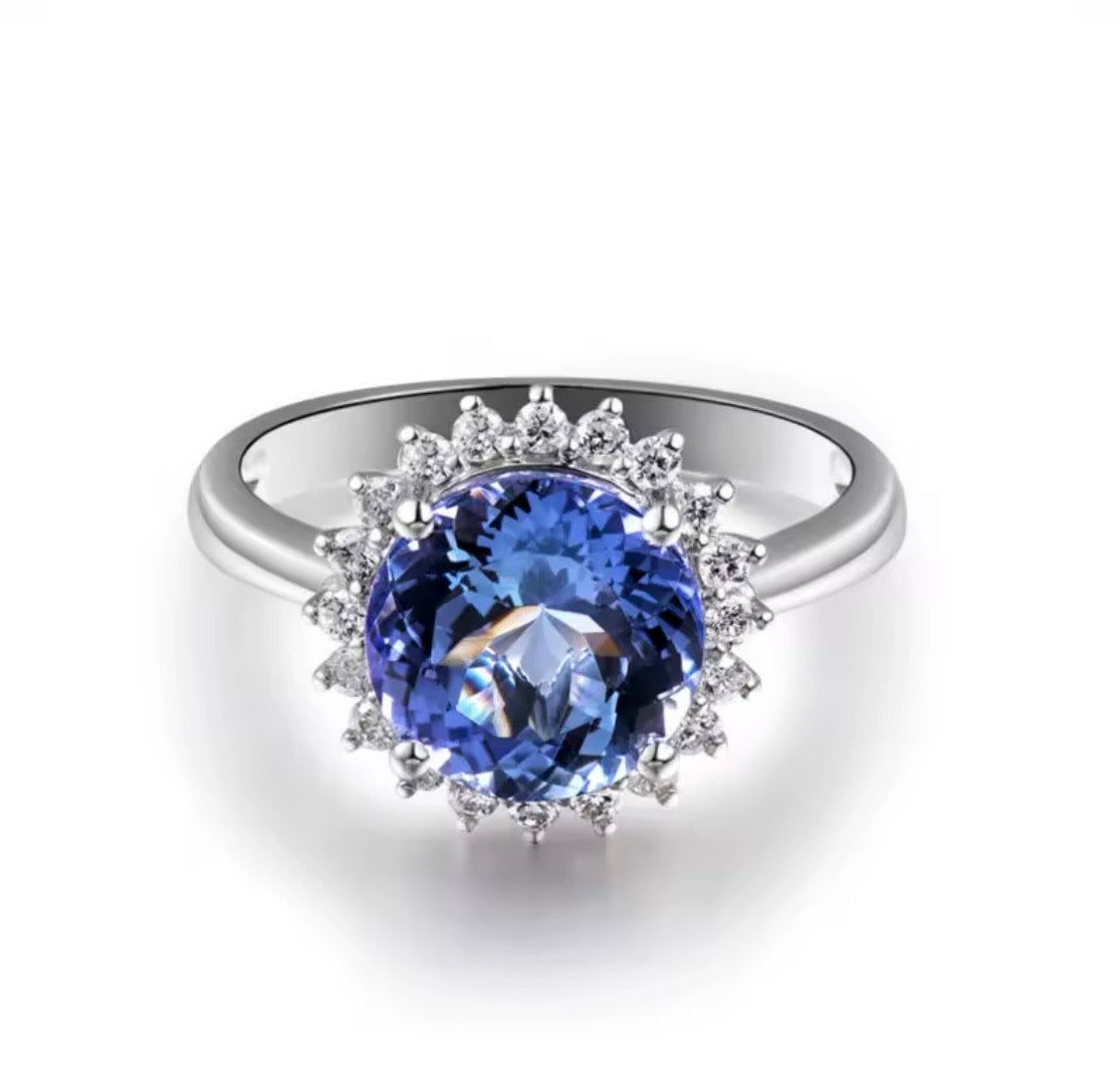 1.60 ct natural round tanzanite with 0.29 ct diamond halo in 18K white gold