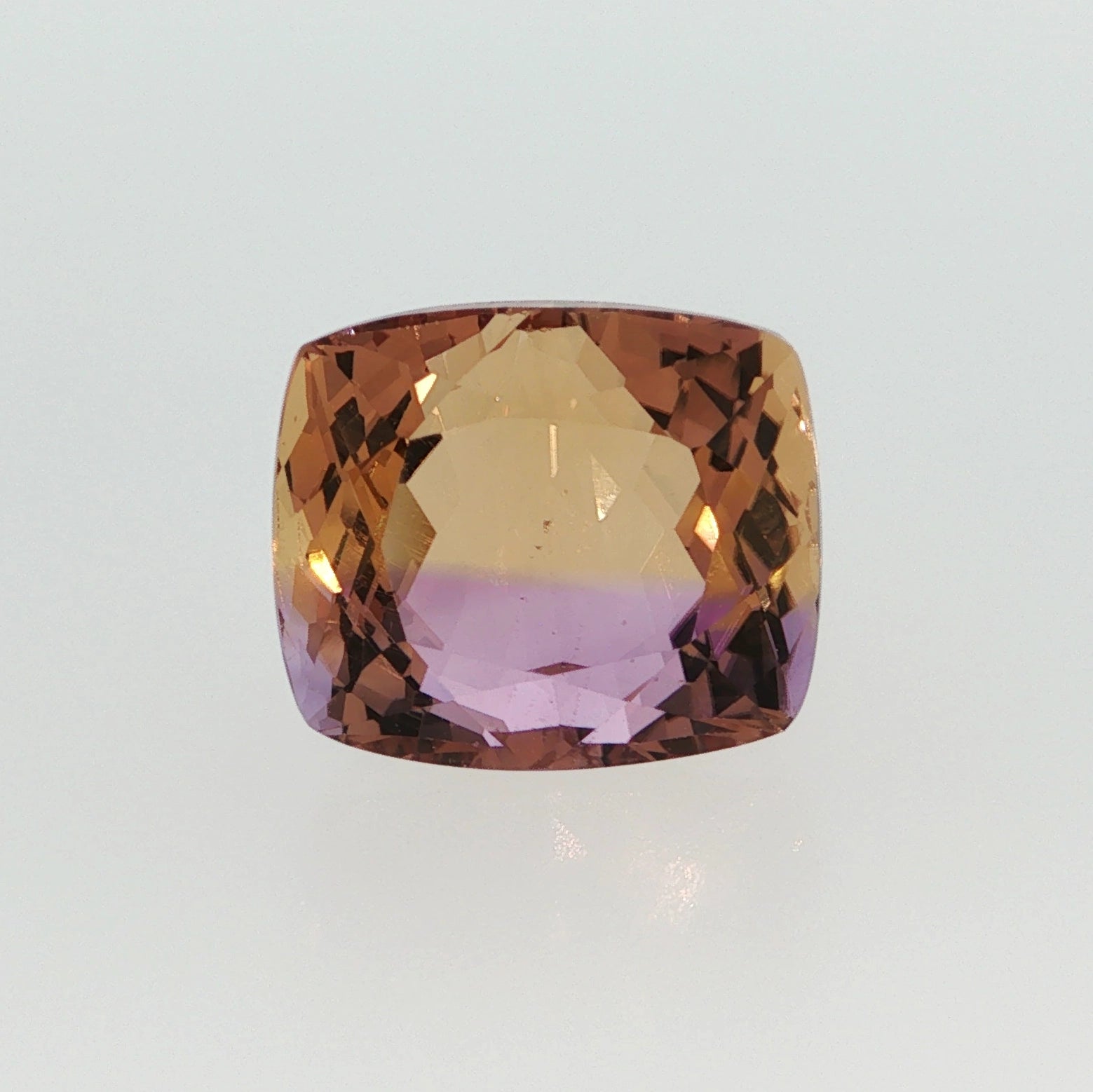 Natural ametrine quartz, 13.20 carats, cushion cut, transparent clarity, violetish purple and orangy yellow, ČGL certified
