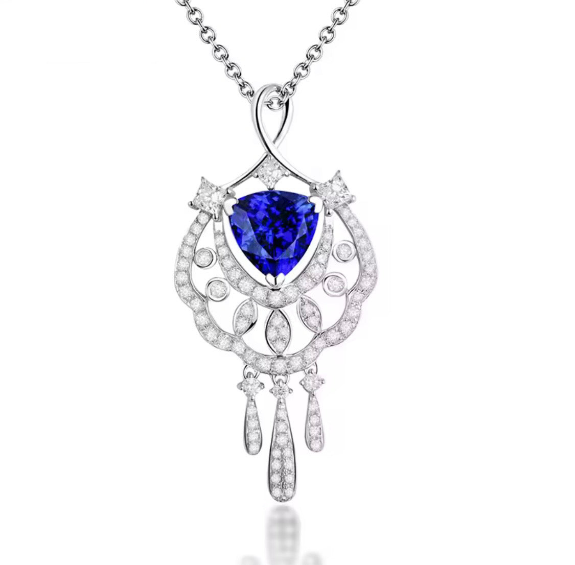 18K gold tanzanite pendant with trillion cut gemstone and diamond design