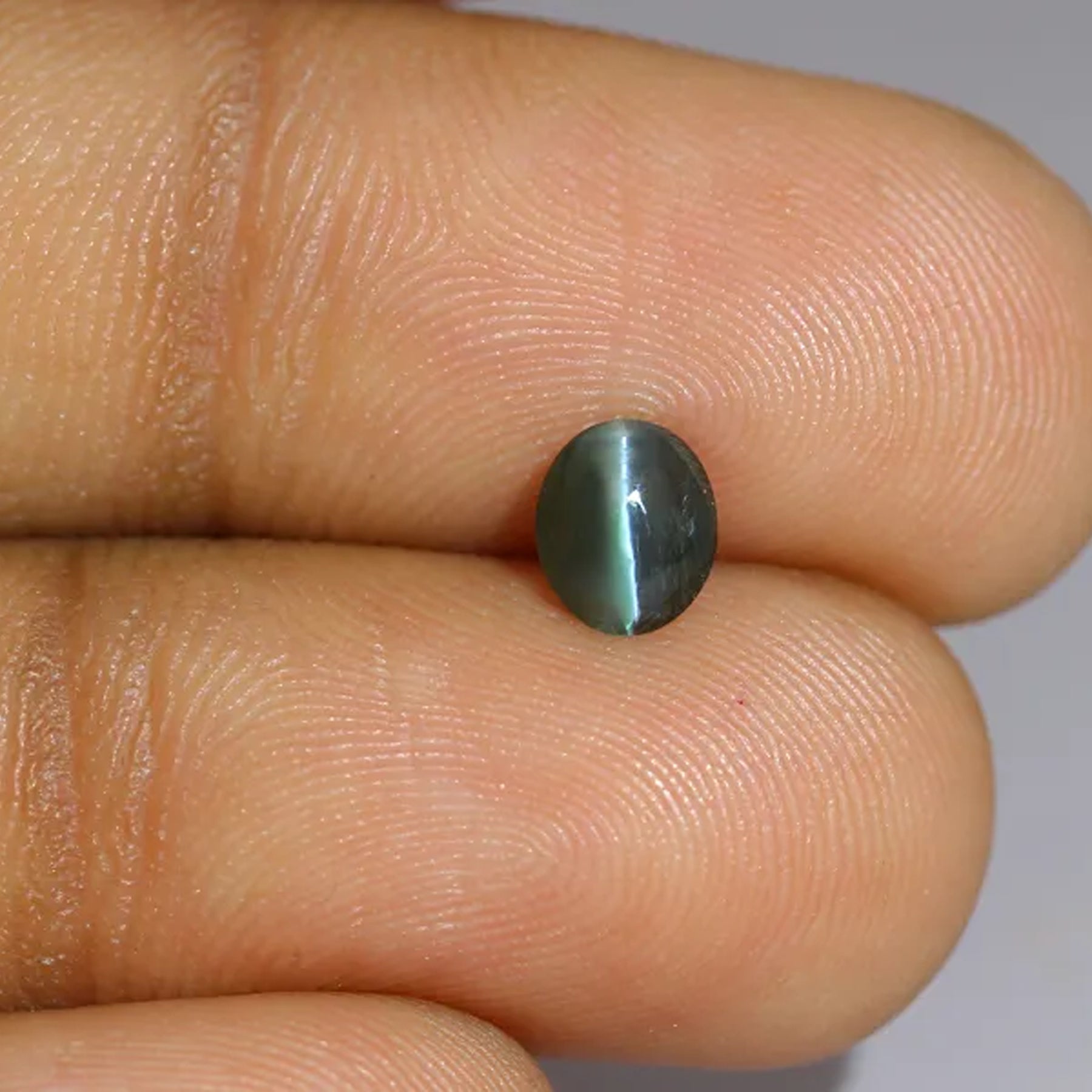 Natural alexandrite, deep green / brownish red, oval cut, 0.97 ct, loose gemstone, view 5.