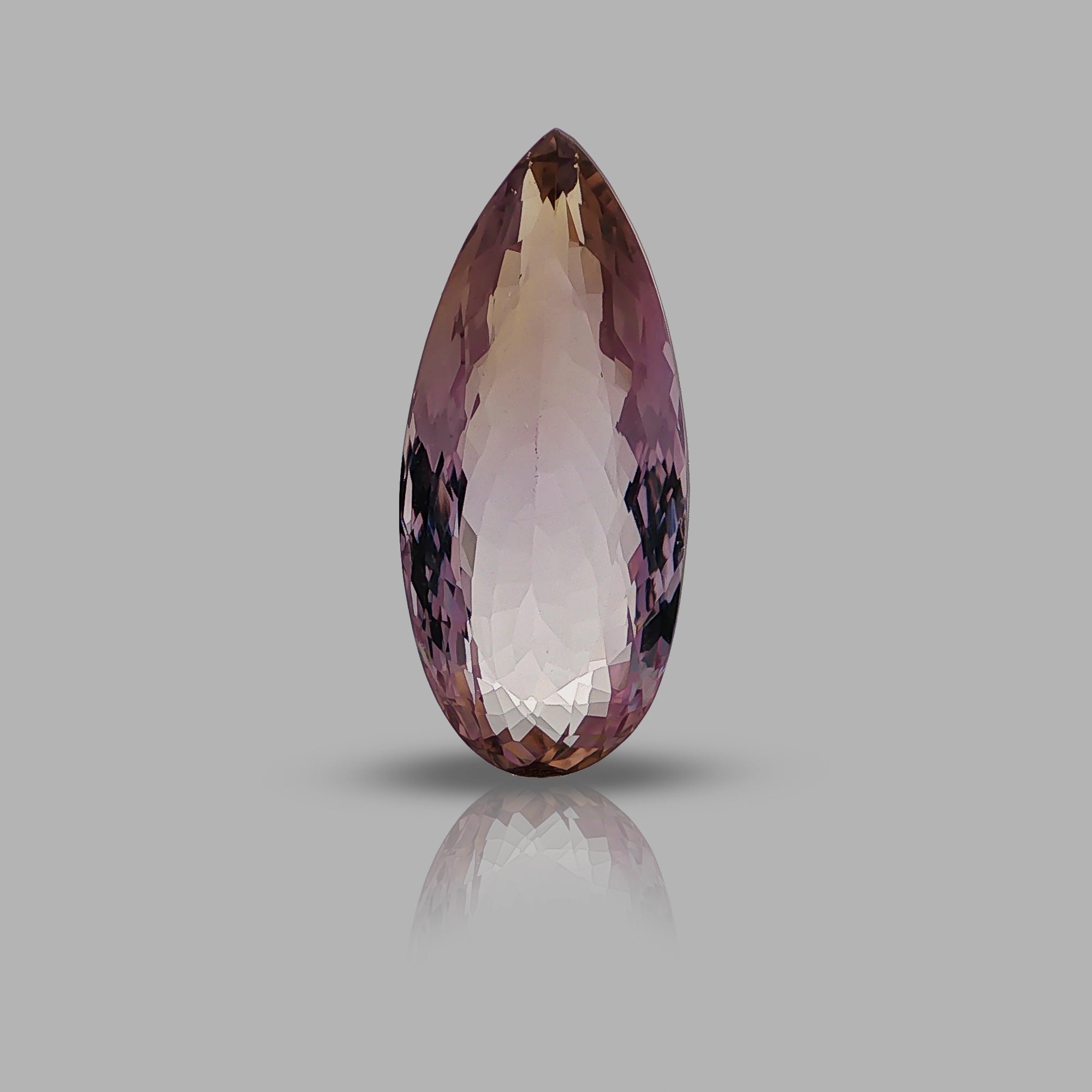 Natural ametrine, light violetish purple / light yellowish orange, pear cut, 27.26 ct, loose gemstone.