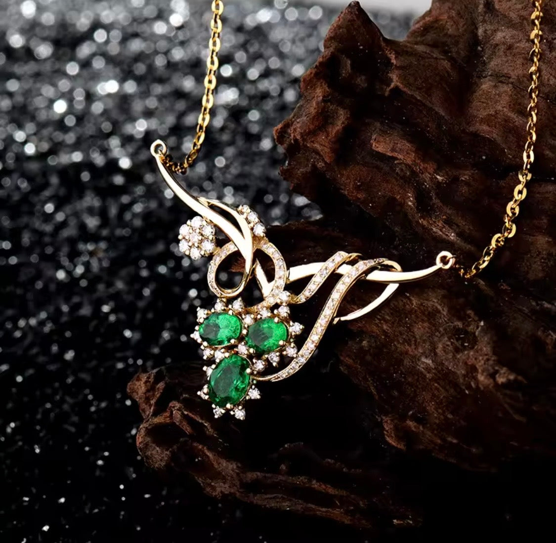 18K gold emerald diamond necklace with 1.72 carat natural emeralds and floral design