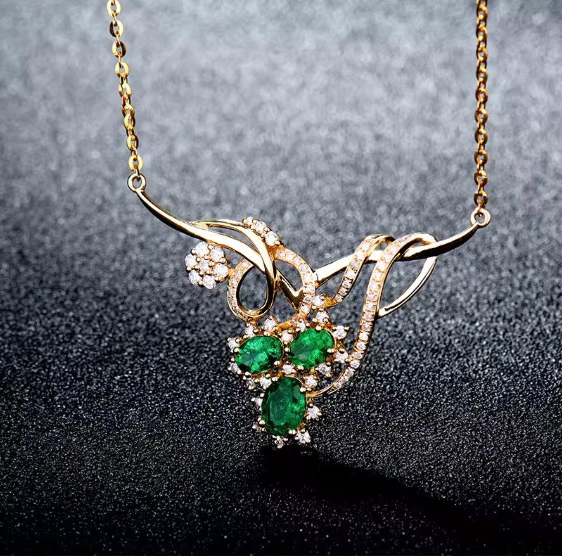 18K gold emerald diamond necklace with 1.72 carat natural emeralds and floral design