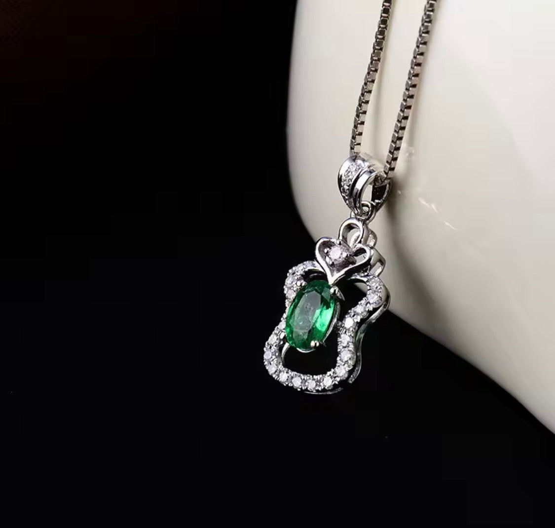 18K white gold emerald diamond pendant with 0.45 carat oval natural emerald and heart halo design