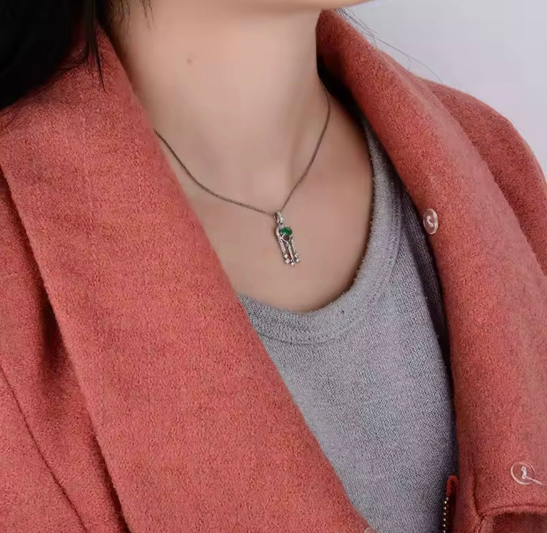 18K white gold emerald diamond pendant with oval natural emerald and geometric drop design