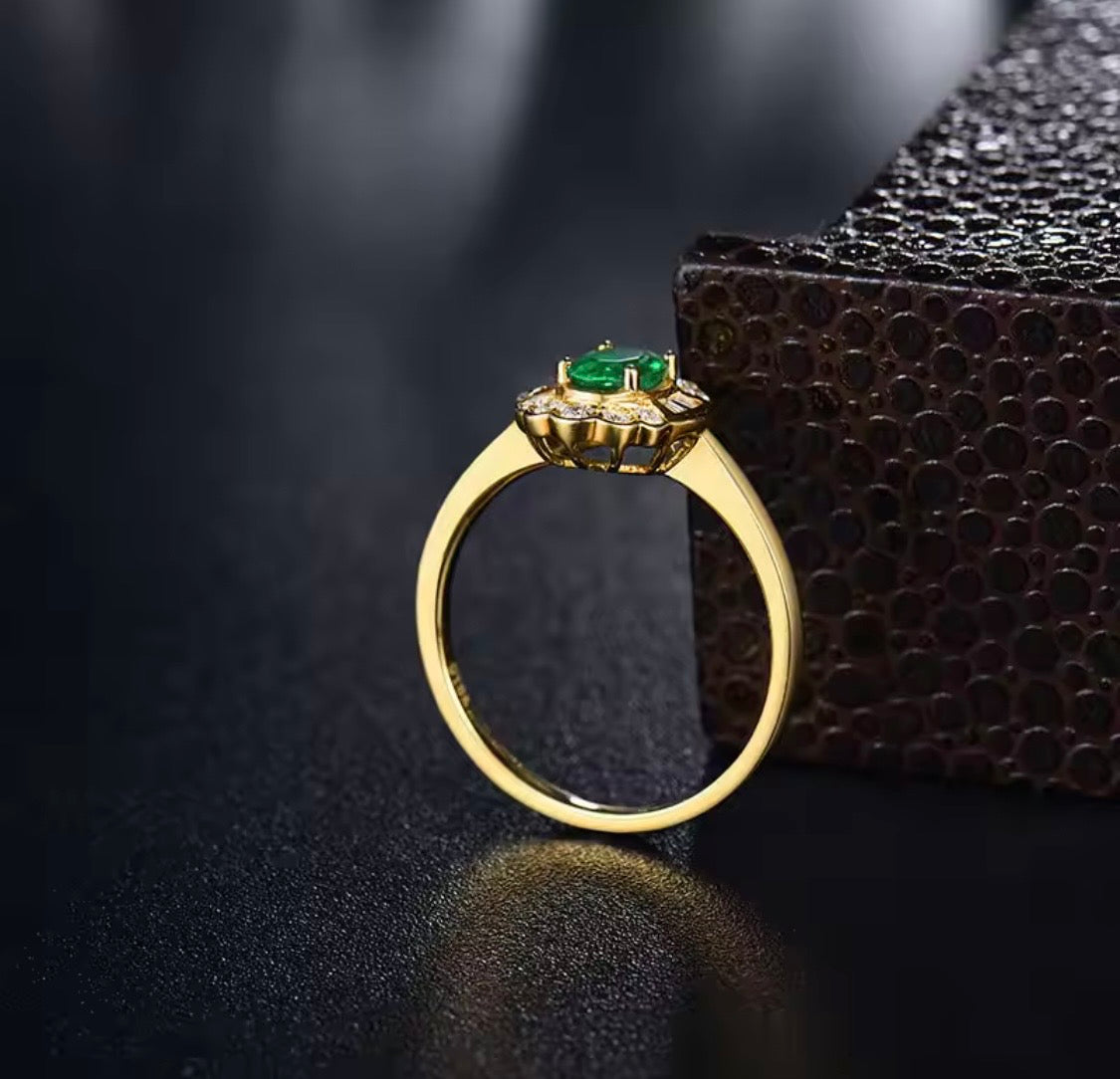 14K yellow gold emerald diamond ring with 0.50 carat oval natural emerald and floral diamond halo