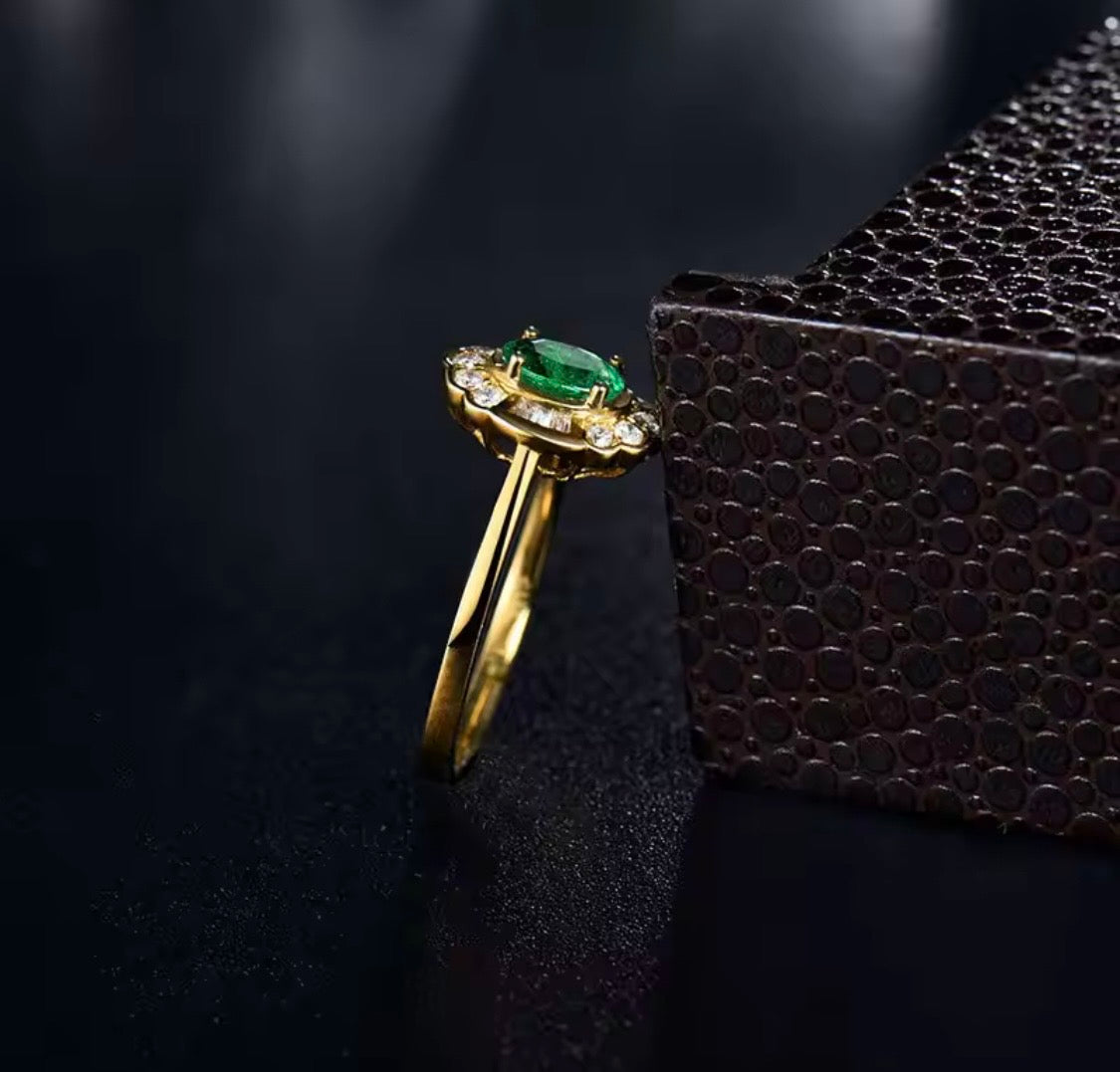 14K yellow gold emerald diamond ring with 0.50 carat oval natural emerald and floral diamond halo