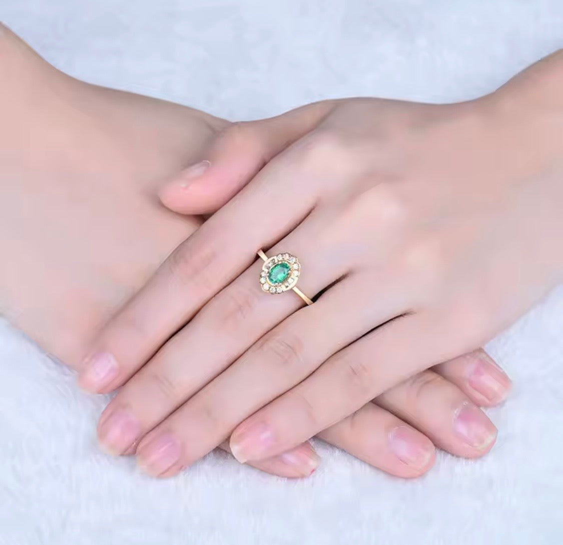 14K yellow gold emerald diamond ring with 0.50 carat oval natural emerald and floral diamond halo